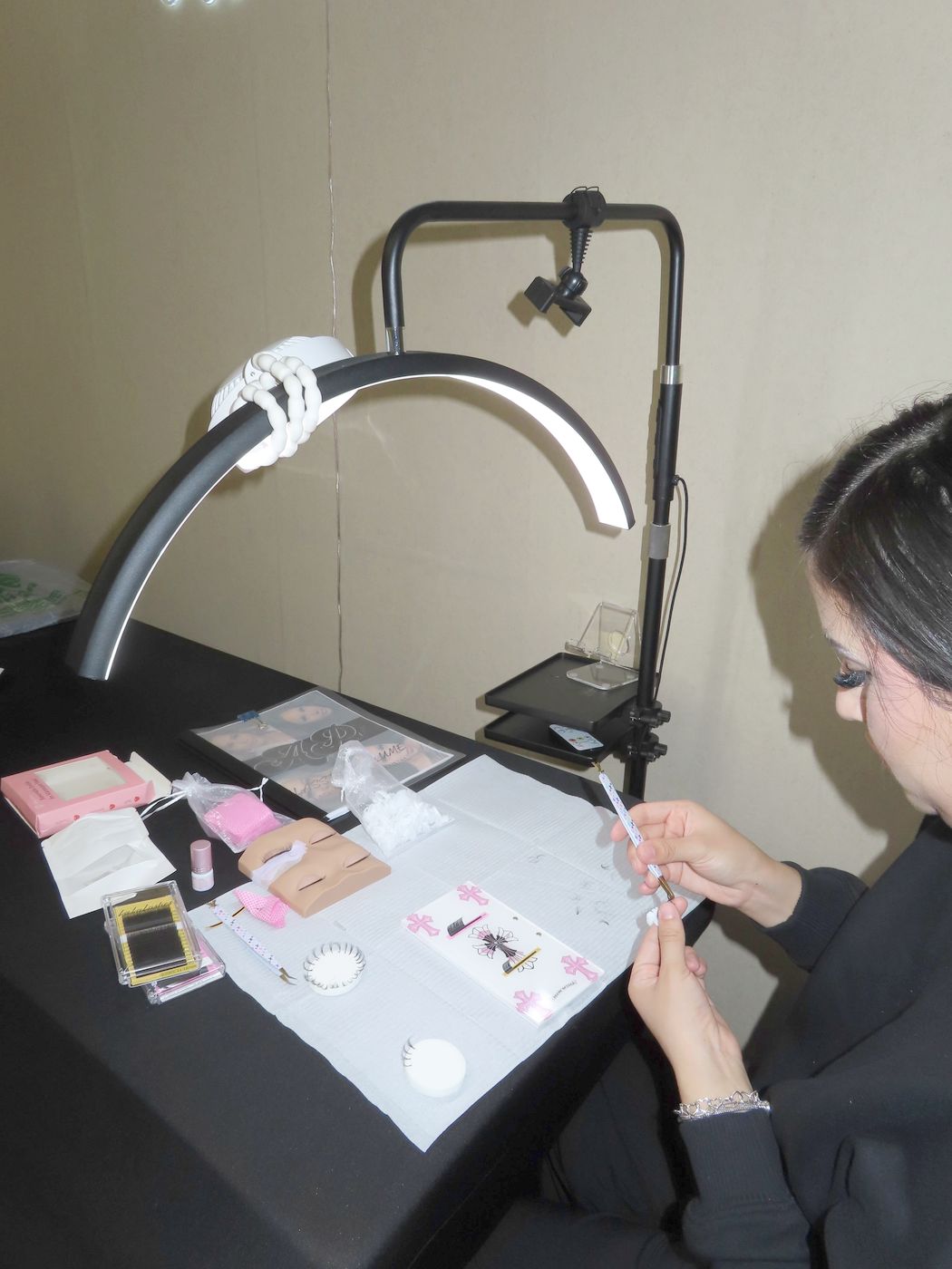 Workstation with lamp, lash trays and practice head